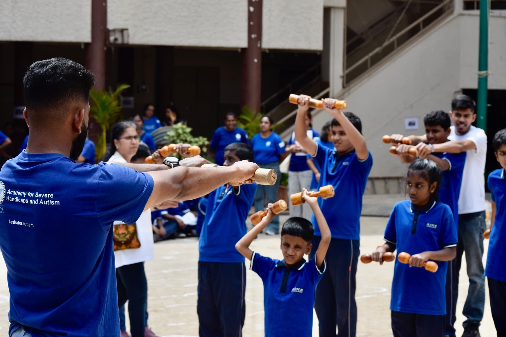 ASHA students engaged in physical activity with educators